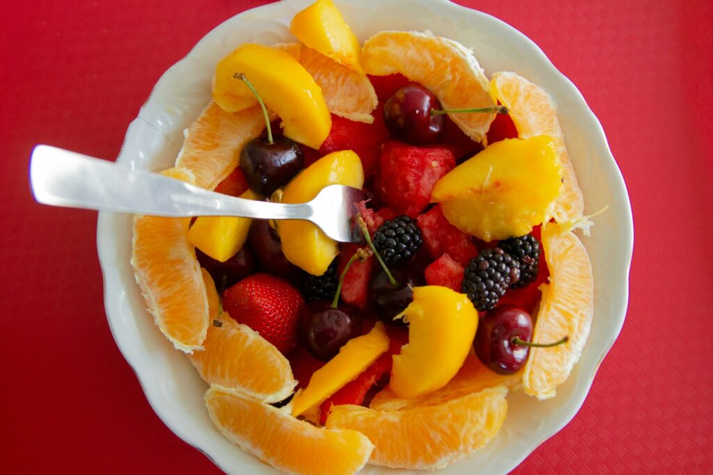 A bowl of fruit on a plate