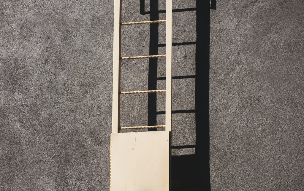 White wooden window frame on gray concrete wall