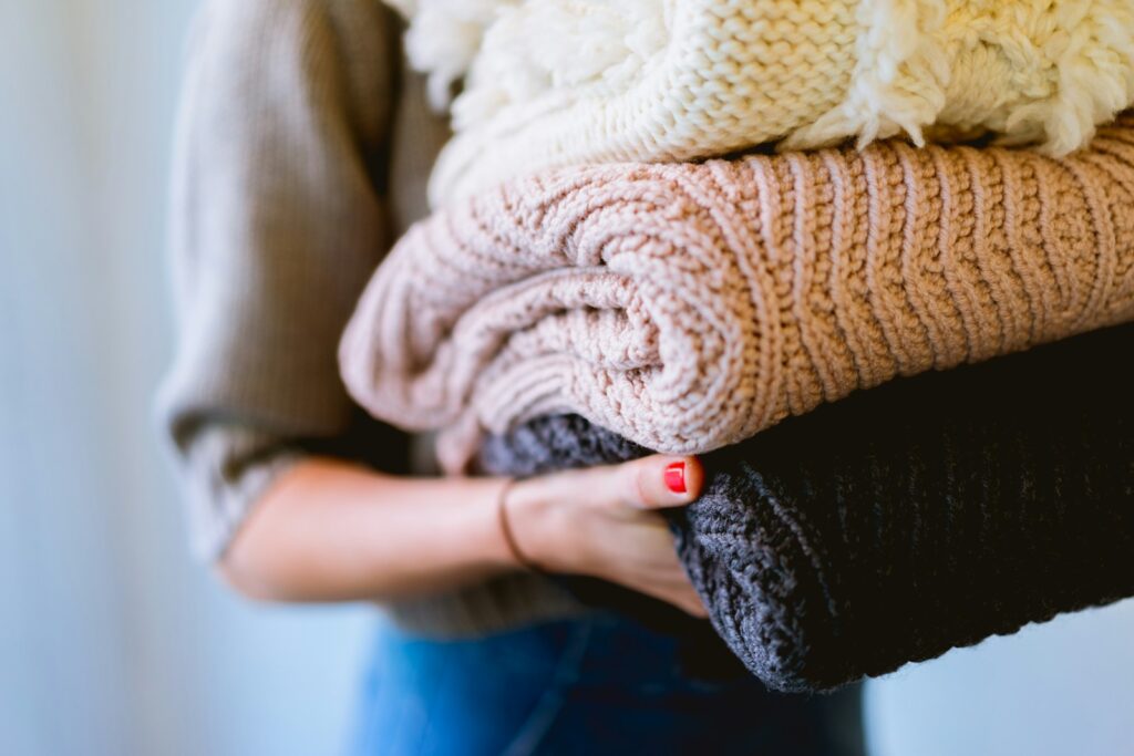 Person holding knitted textiles