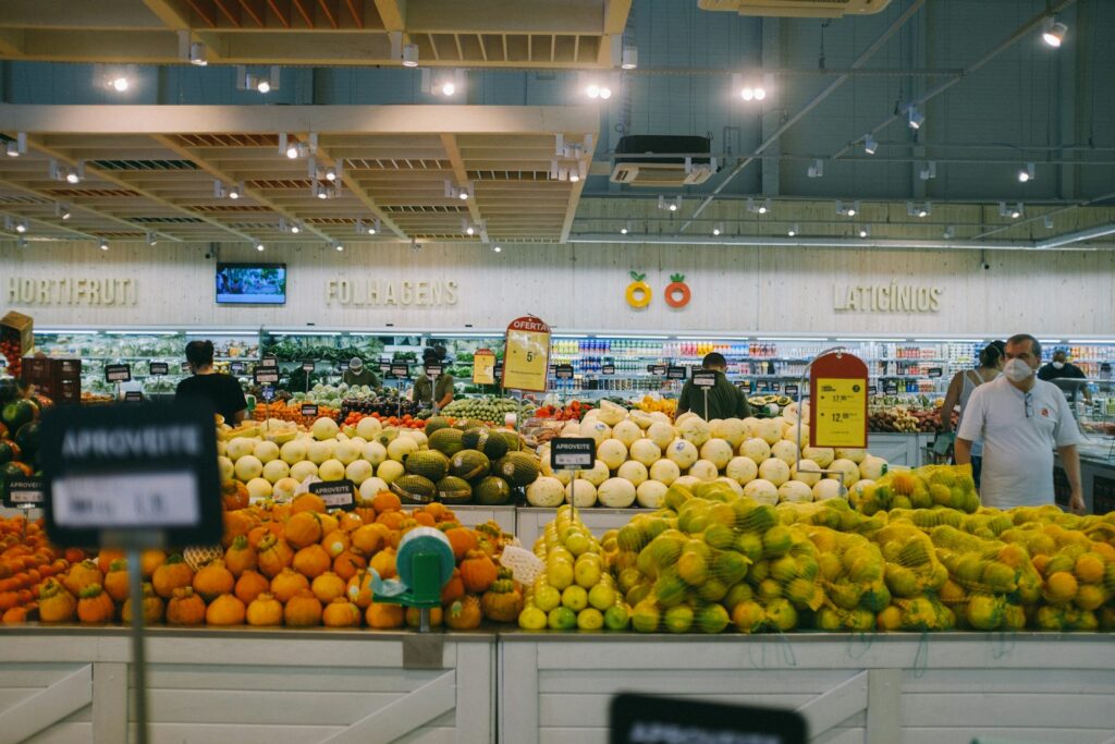 Yellow and green fruits on white metal rack