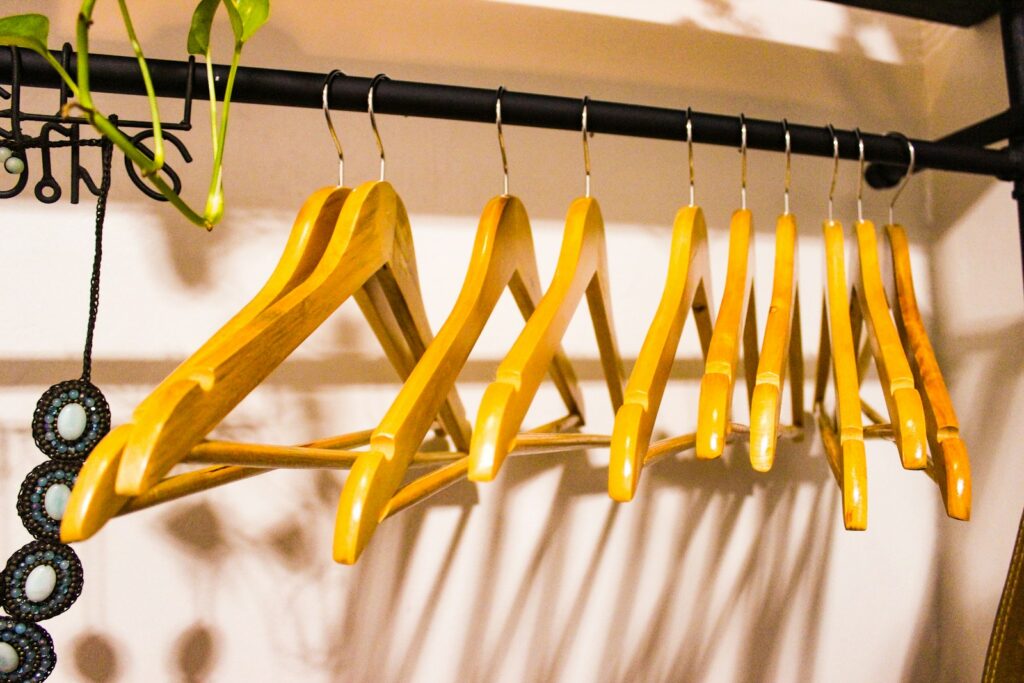 A rack of clothes hanging on a wall