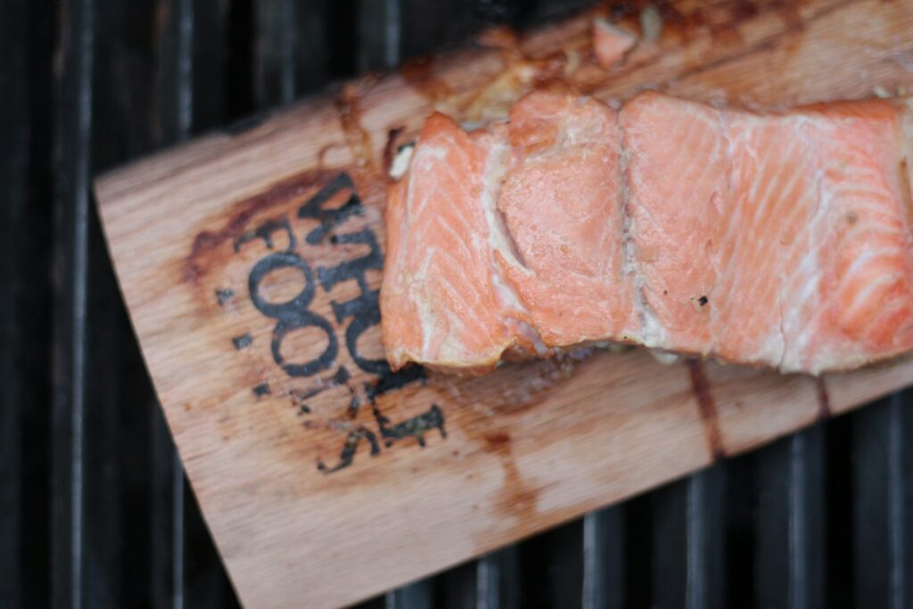 Sliced salmon meat on board
