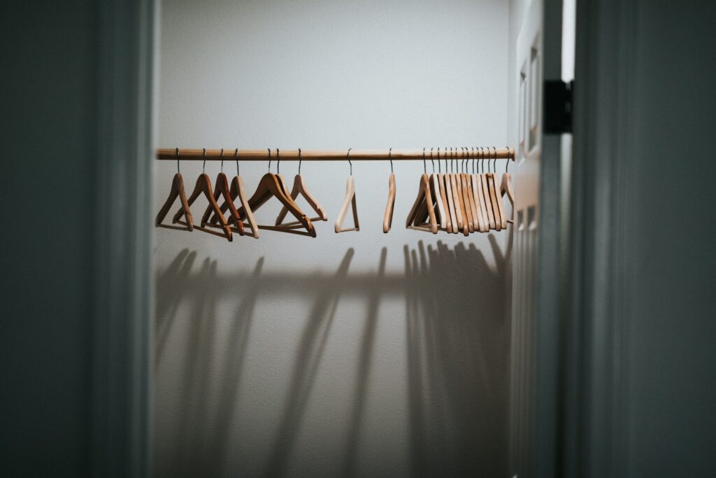 White and brown clothes hanger