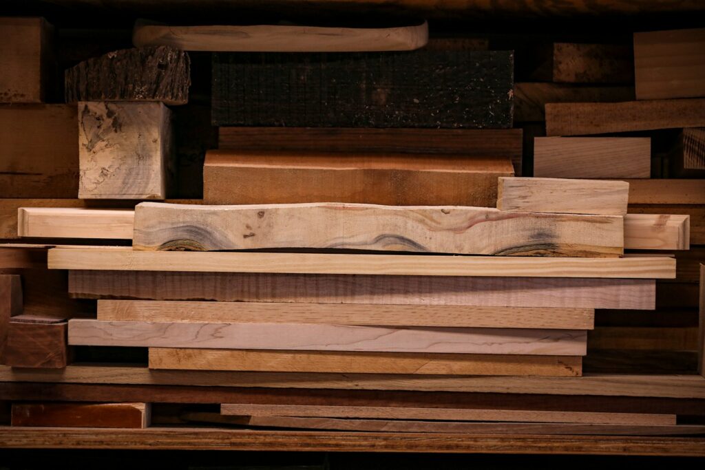 A pile of wooden planks stacked on top of each other