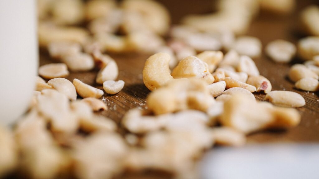 Brown and white cookies on brown wooden table