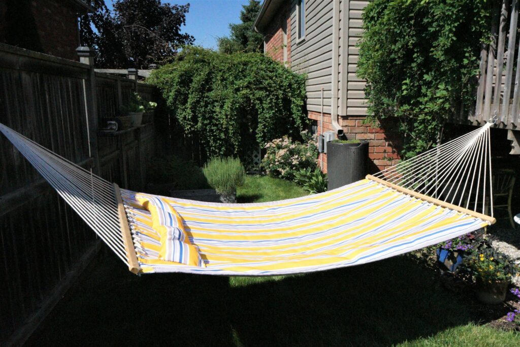 A hammock on a fence.