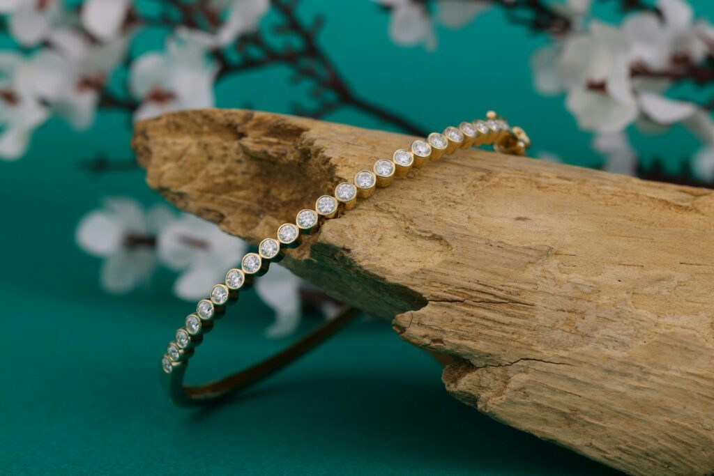 A close up of a bracelet on a piece of wood
