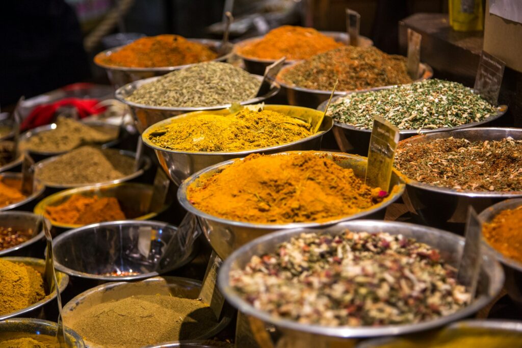 Different spices in stainless steel bowls.