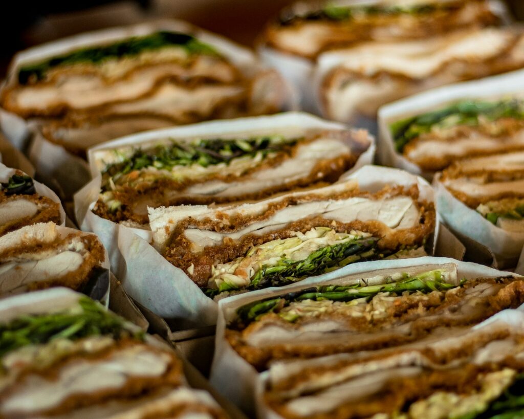 A close up of a tray of sandwiches.
