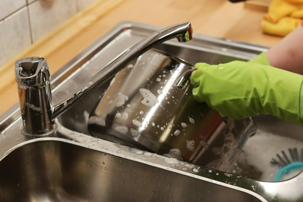 Stainless steel sink with faucet.
