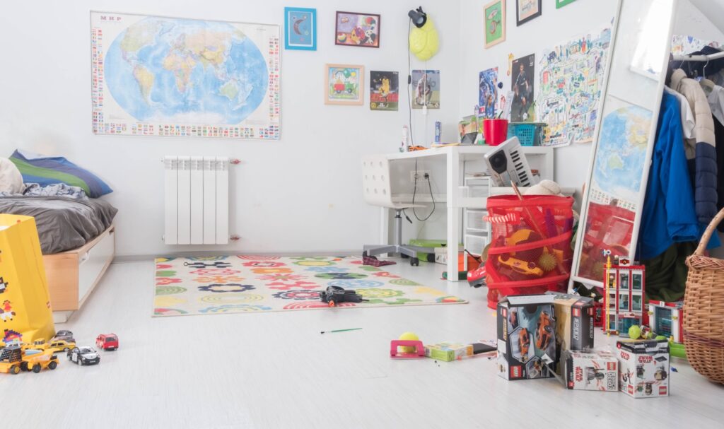 Pile of assorted-color toy boxes in a room.