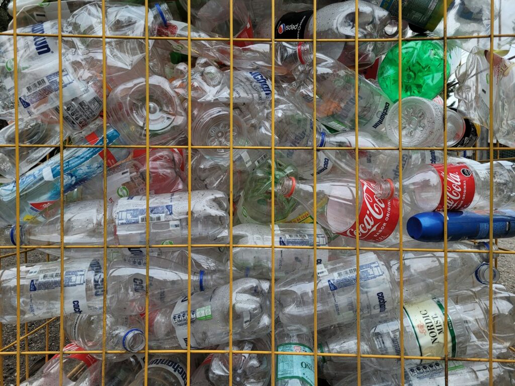 A bunch of bottles that are in a cage.