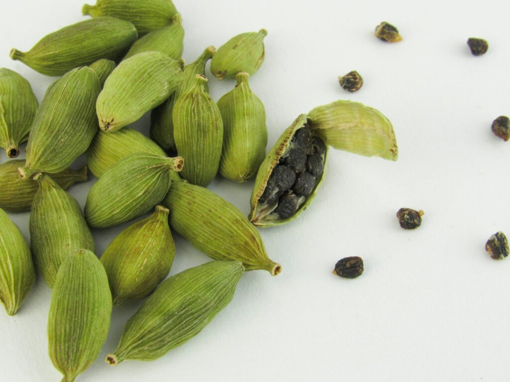 A pile of green beans sitting on top of a white table.