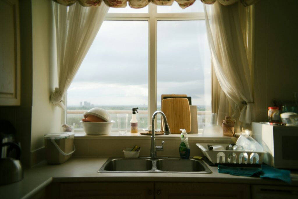 A kitchen with a sink and a window.
