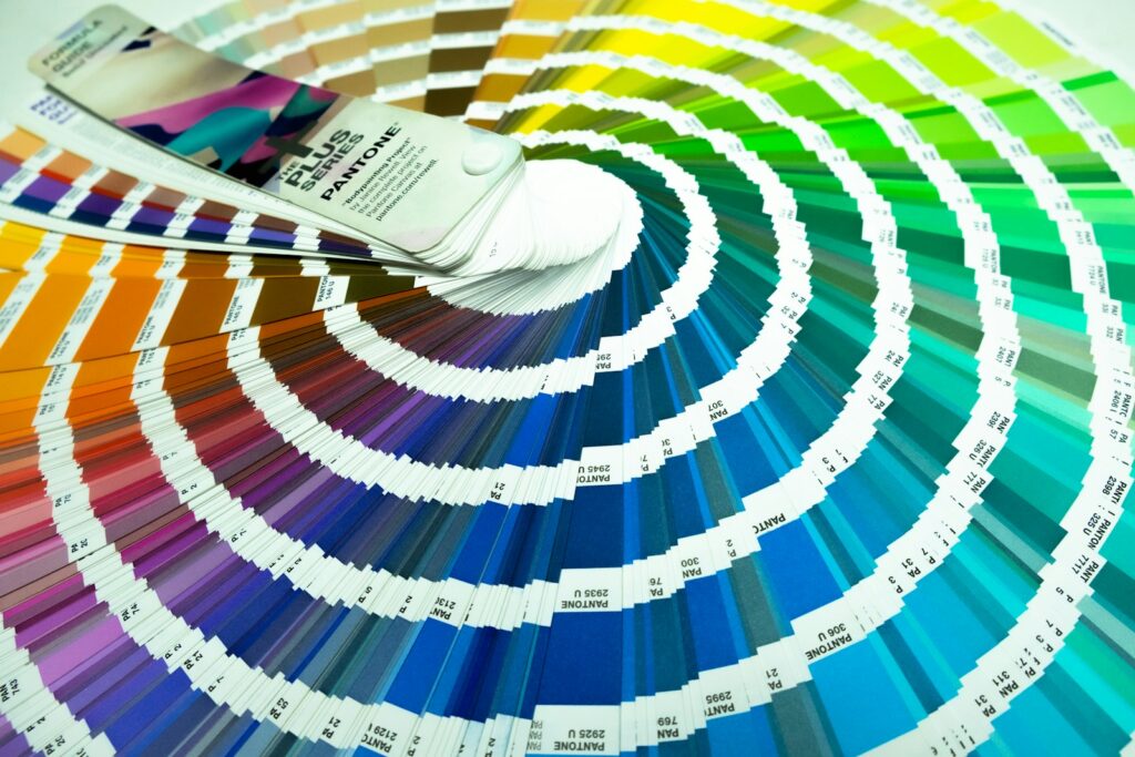 A pan of paint with a brush on top of it