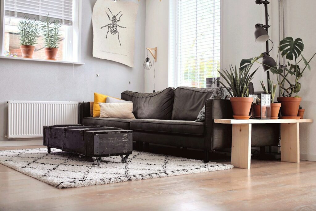 Black two-seat sofa and coffee table inside room