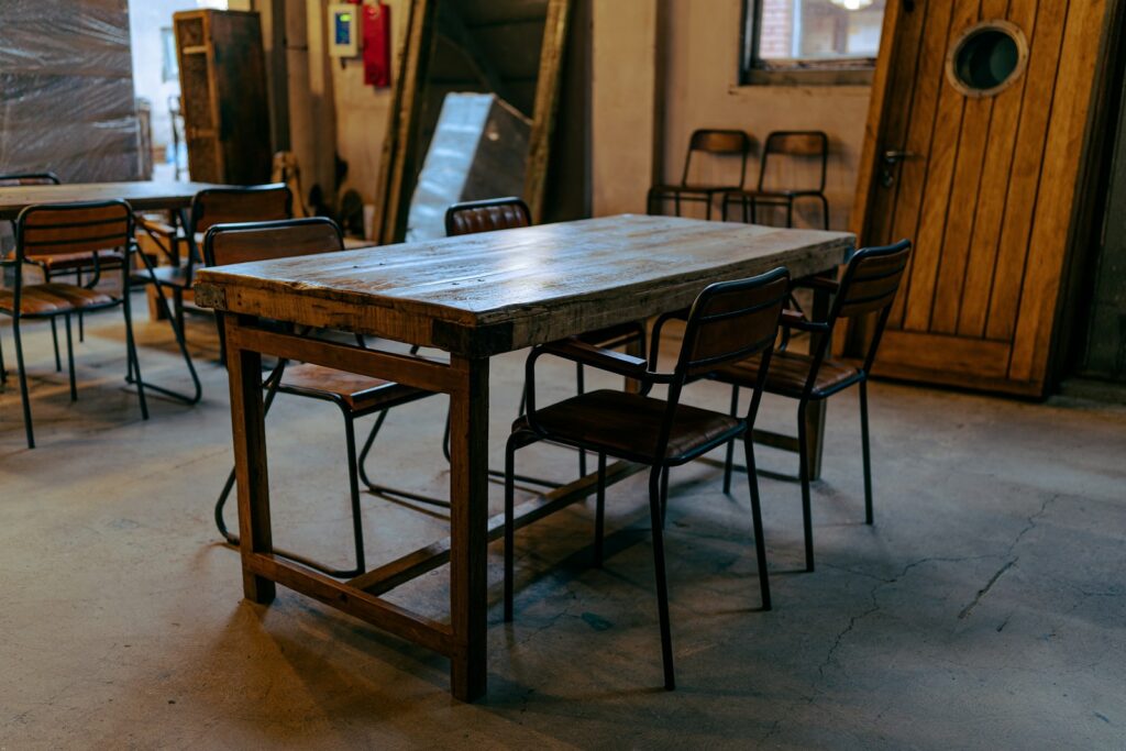 Brown wooden table with chairs.