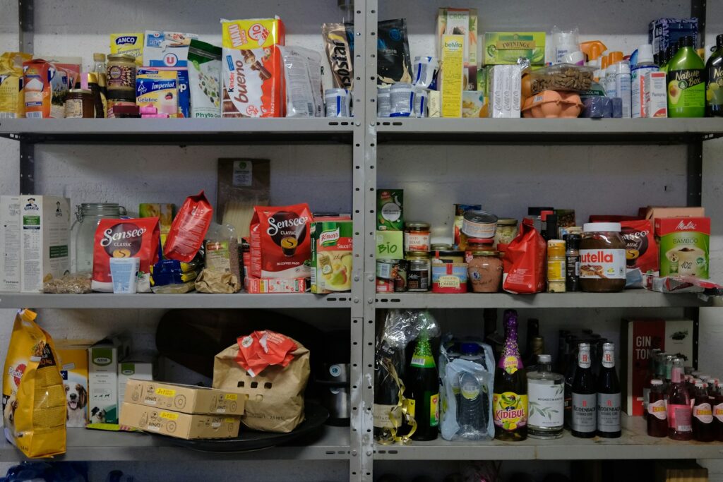 A shelf filled with lots of food items