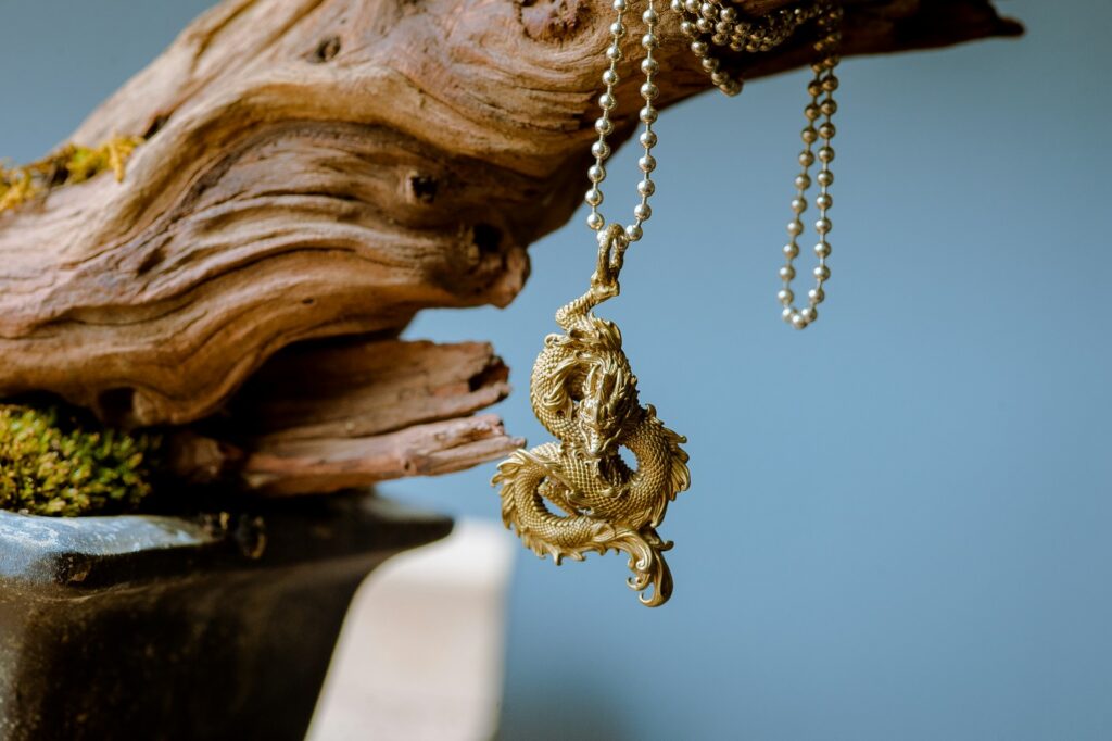 A close up of a necklace on a tree branch