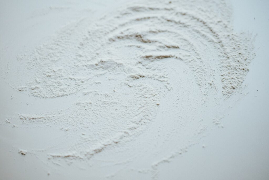 White snow on brown soil