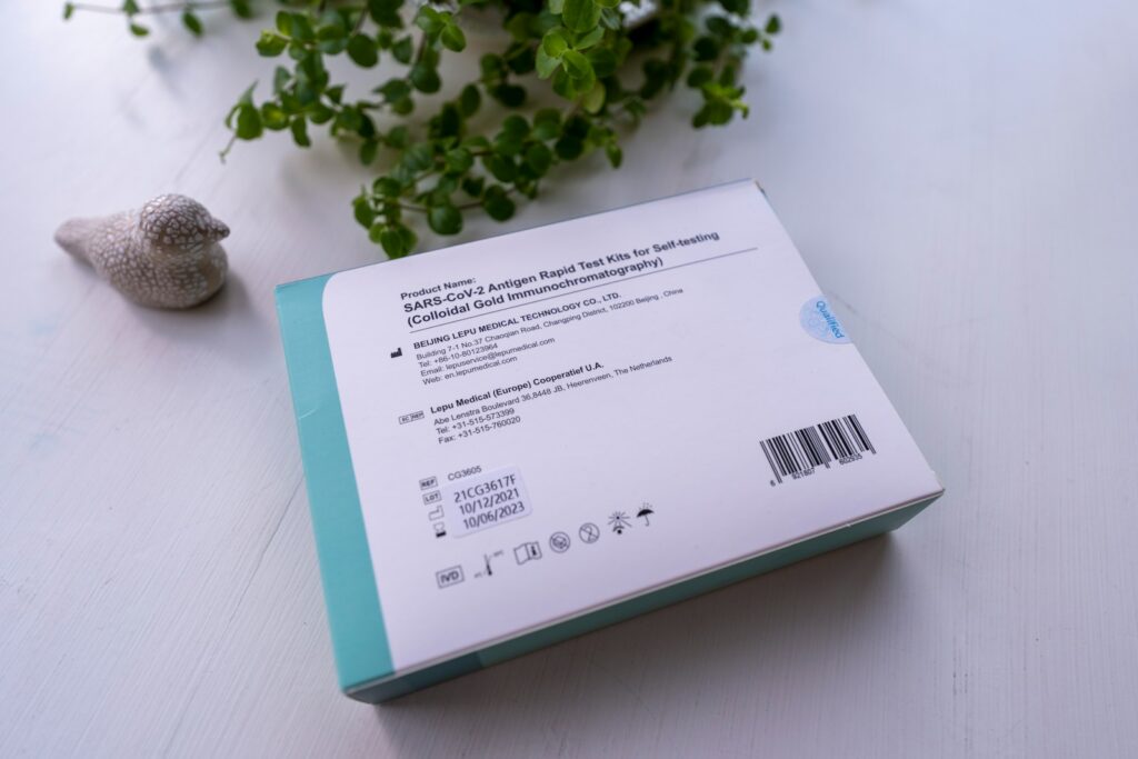 A box of baby wipes on a table, showcasing its product certifications for safety and quality assurance.