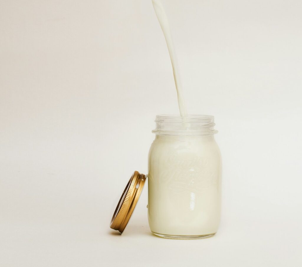 Mason jar filled with milk.