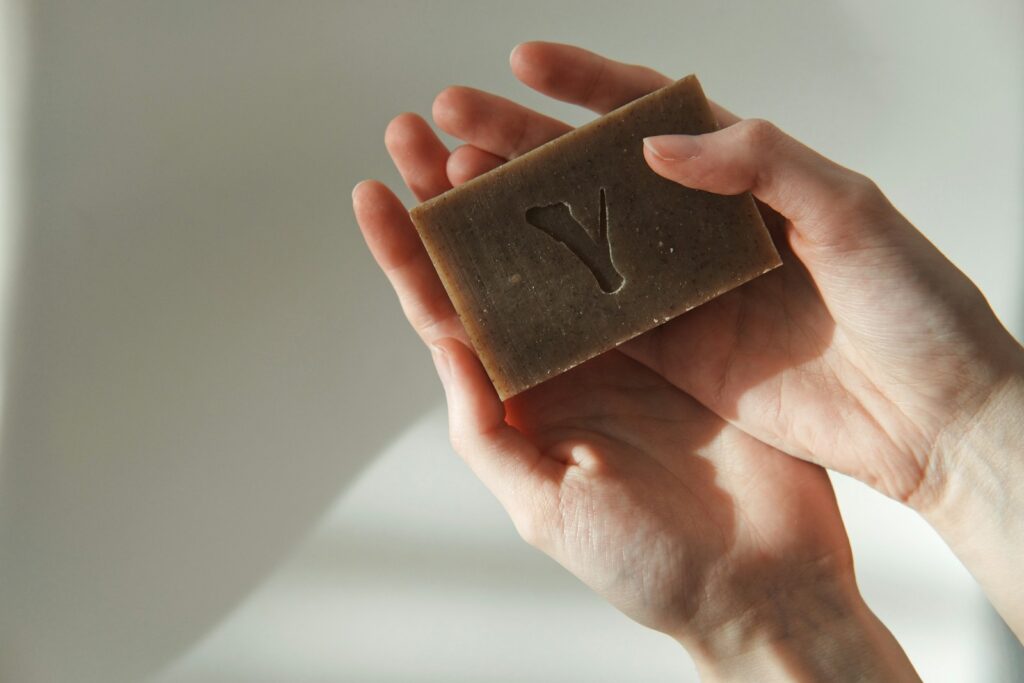 Brown rectangular box on persons hand