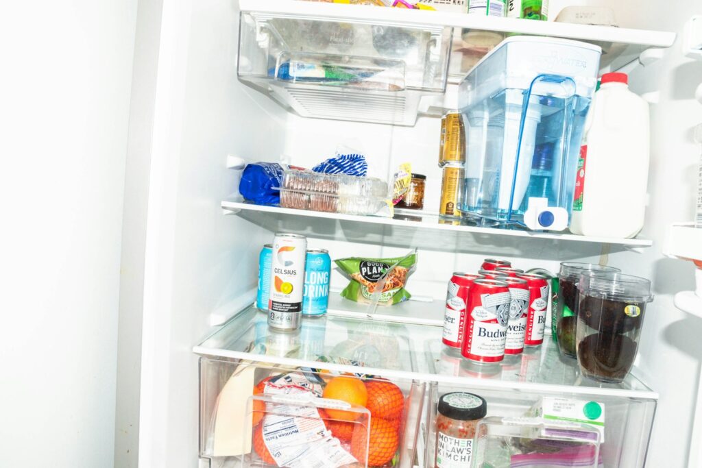 A refrigerator filled with lots of food and drinks.